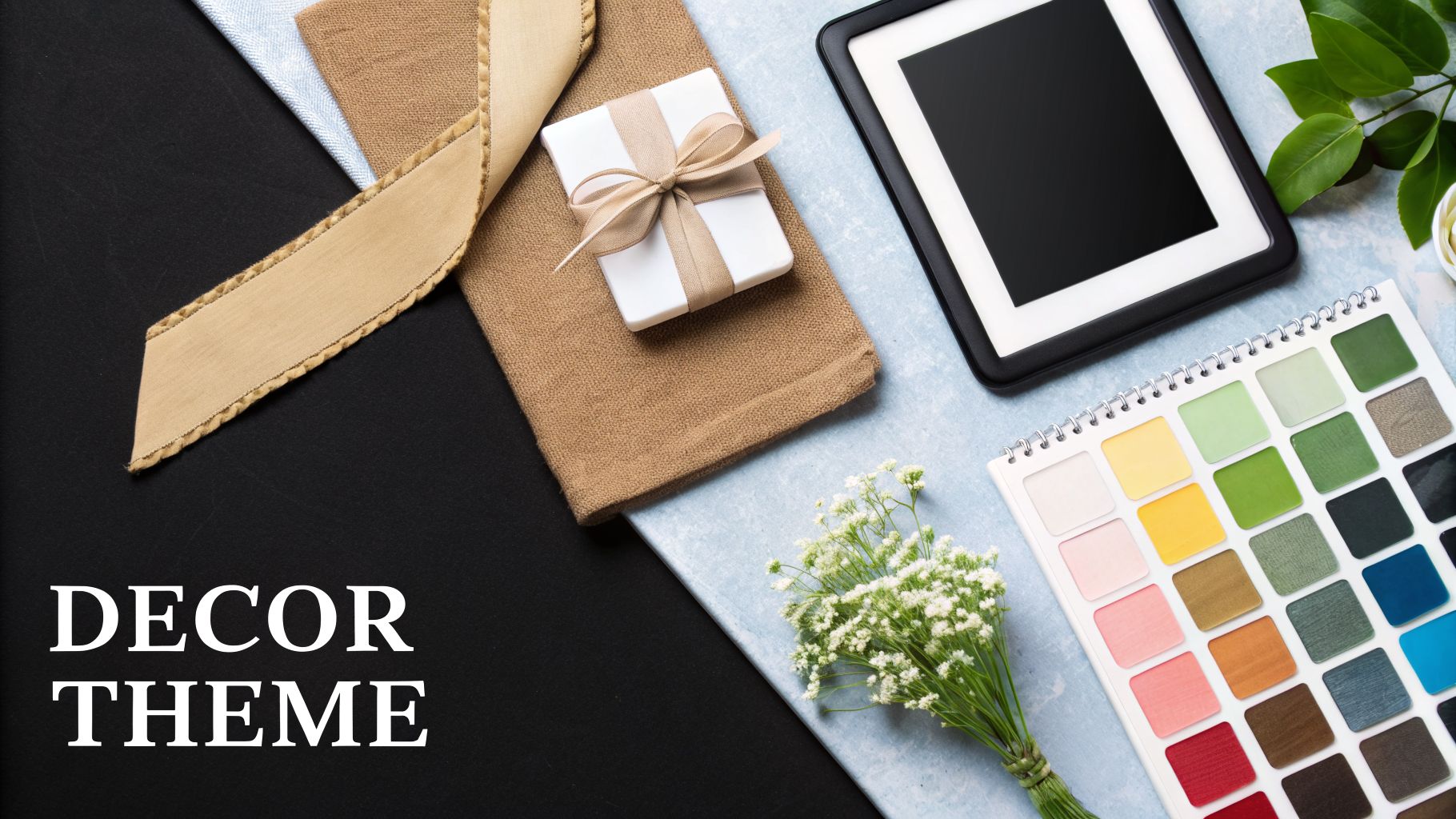 A flat lay of decor items including a gift, color palette, frame, and flowers, suggesting wedding theme inspiration.