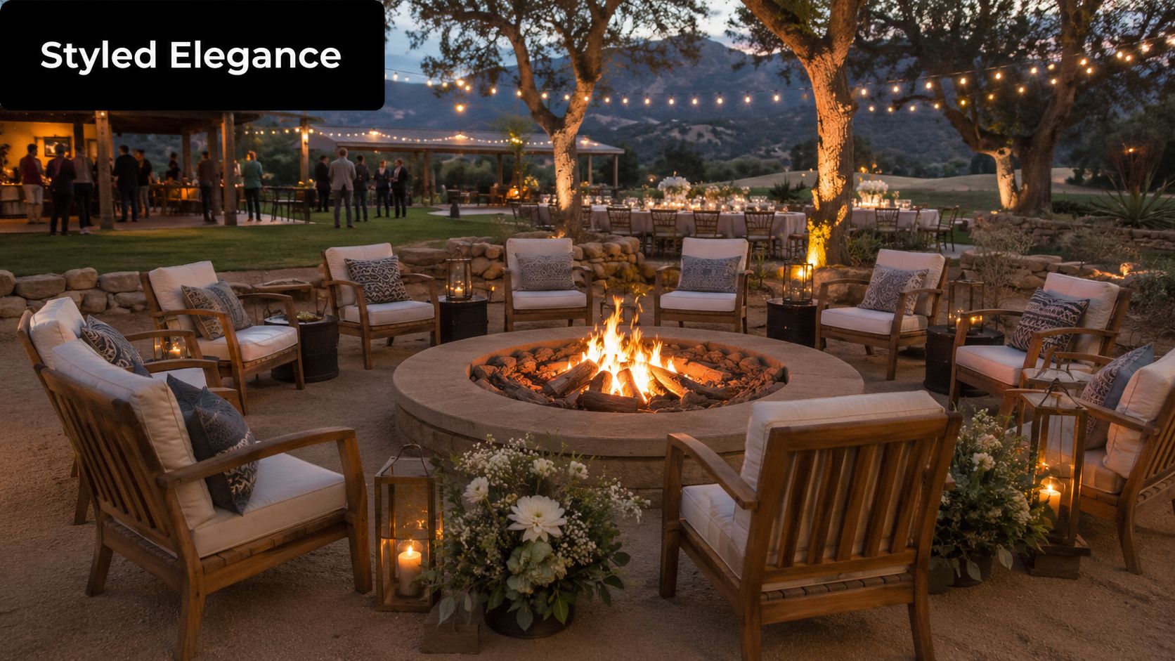 A cozy outdoor lounge area featuring a large round fire pit surrounded by comfortable wooden armchairs.