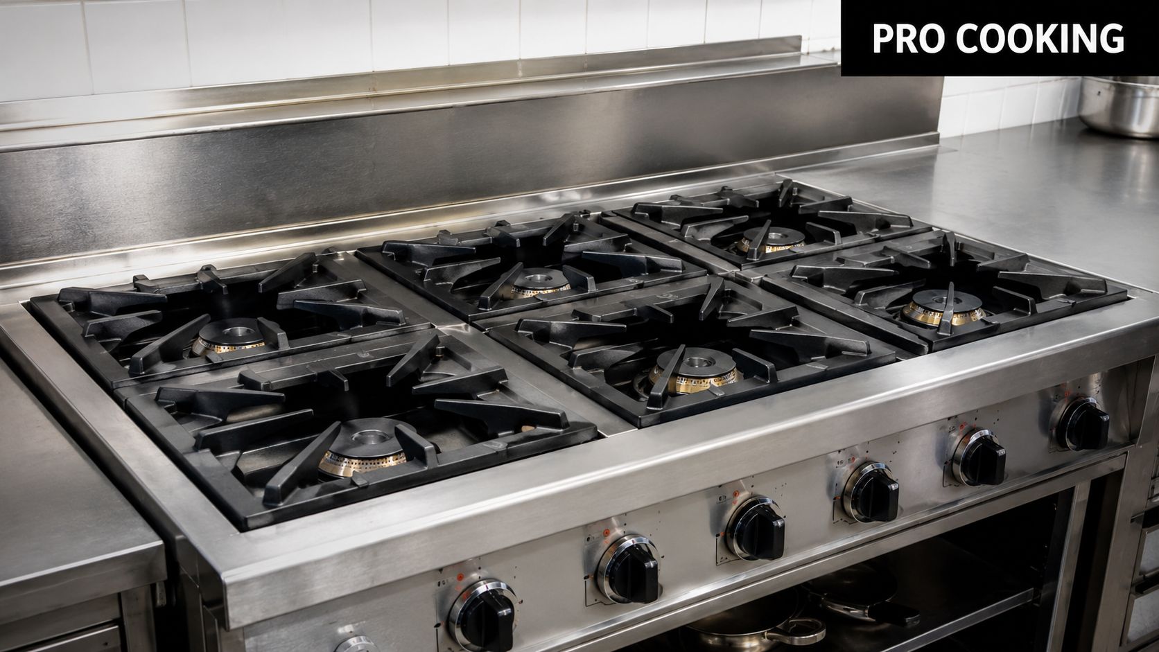 A professional industrial gas stove with six heavy-duty burners and stainless steel finishes in a commercial kitchen.