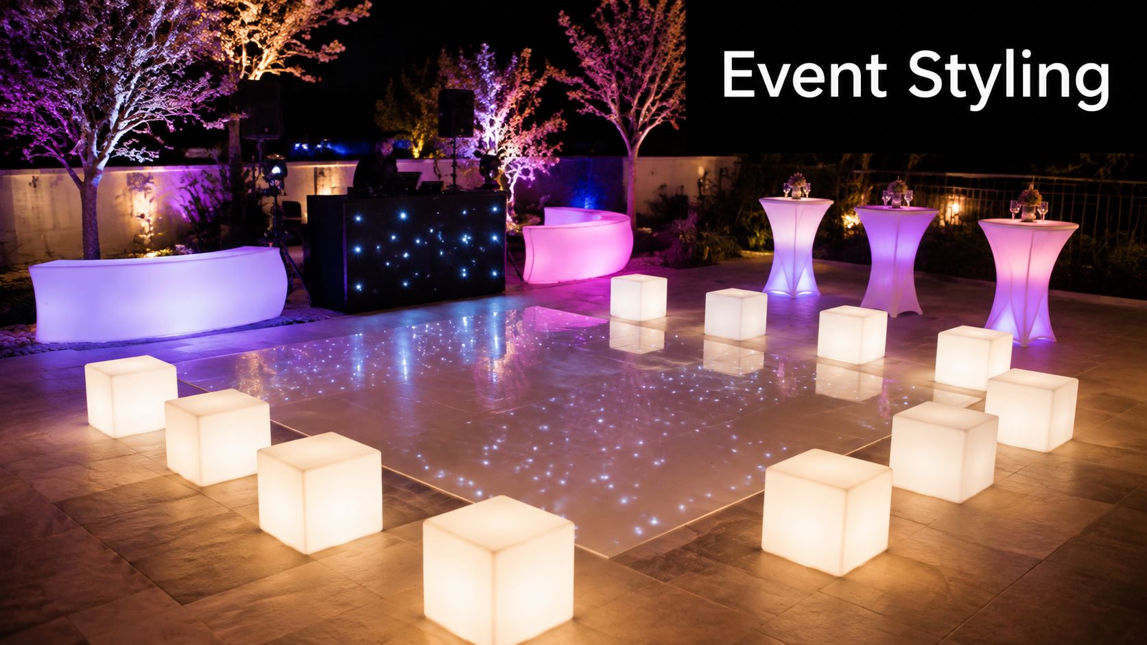 An outdoor evening event setup featuring a glowing white LED dance floor with surrounding cube stools.