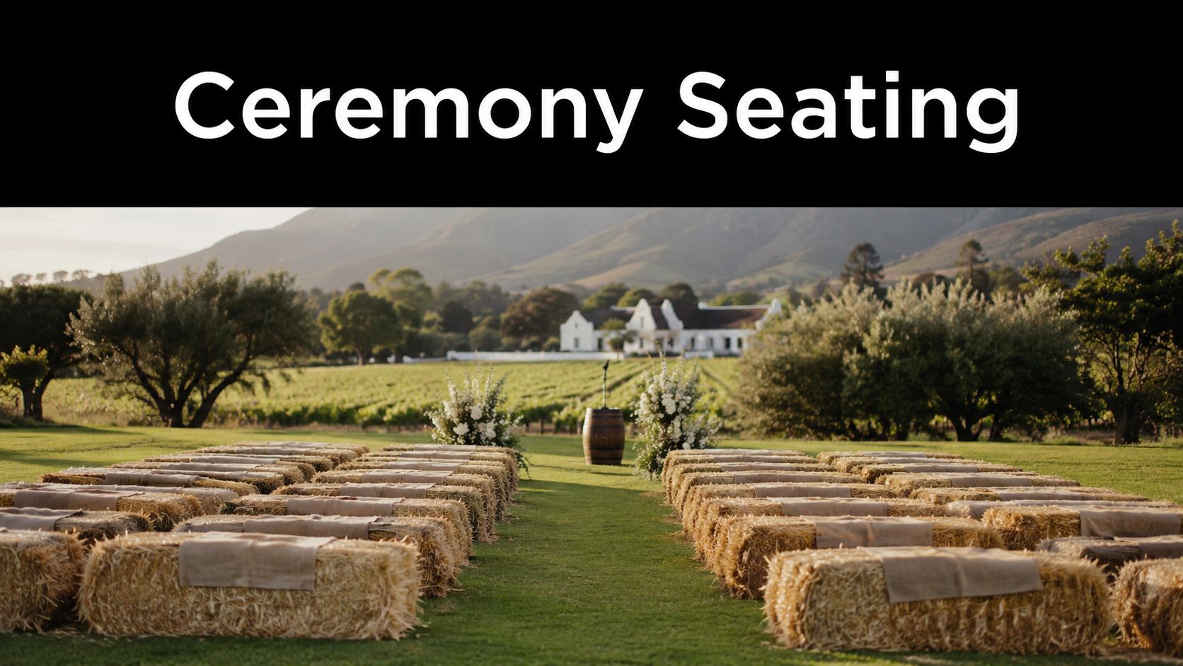 Rows of straw bale seats with burlap runners set up for an outdoor wedding ceremony in vineyard.